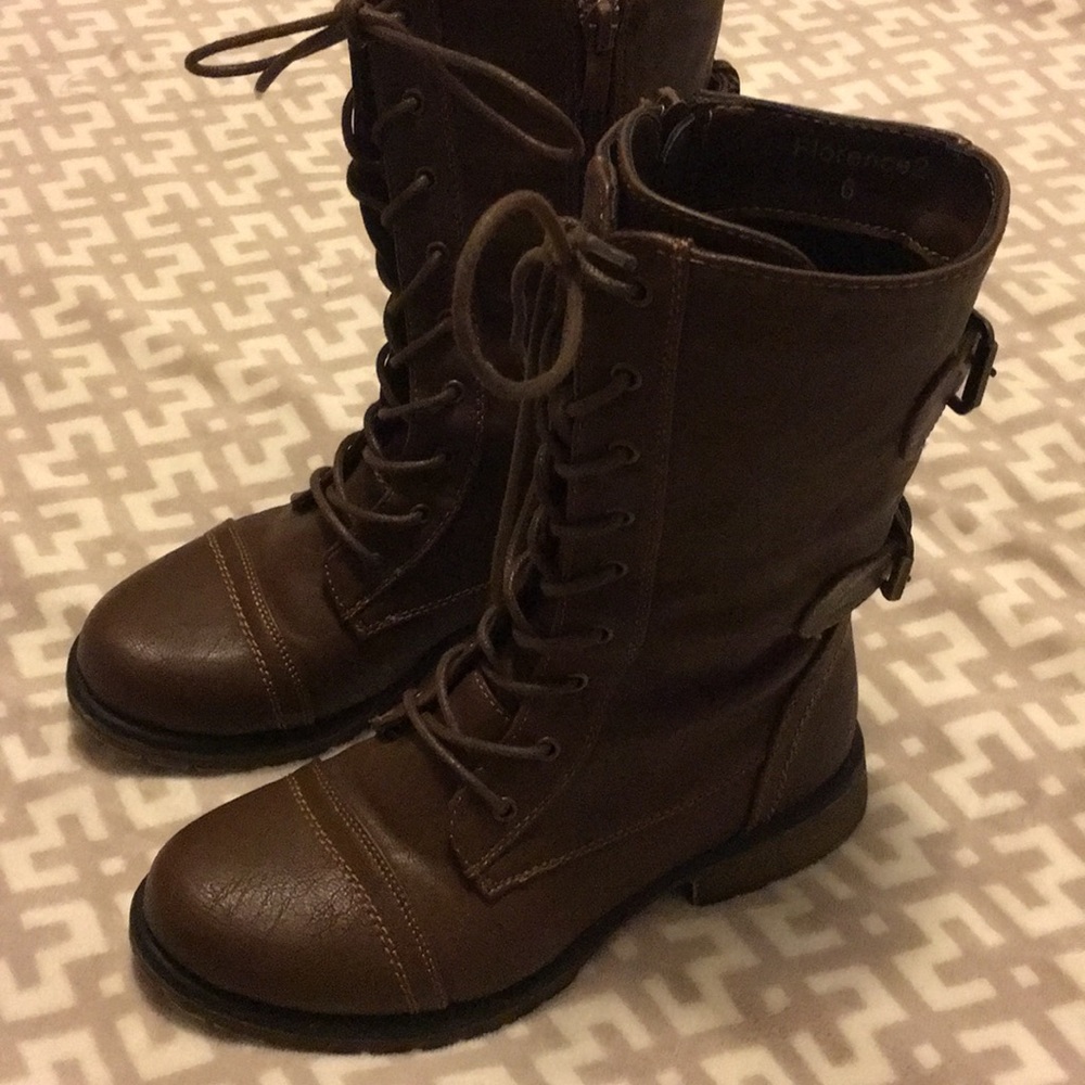 Woman’s brown combat boots